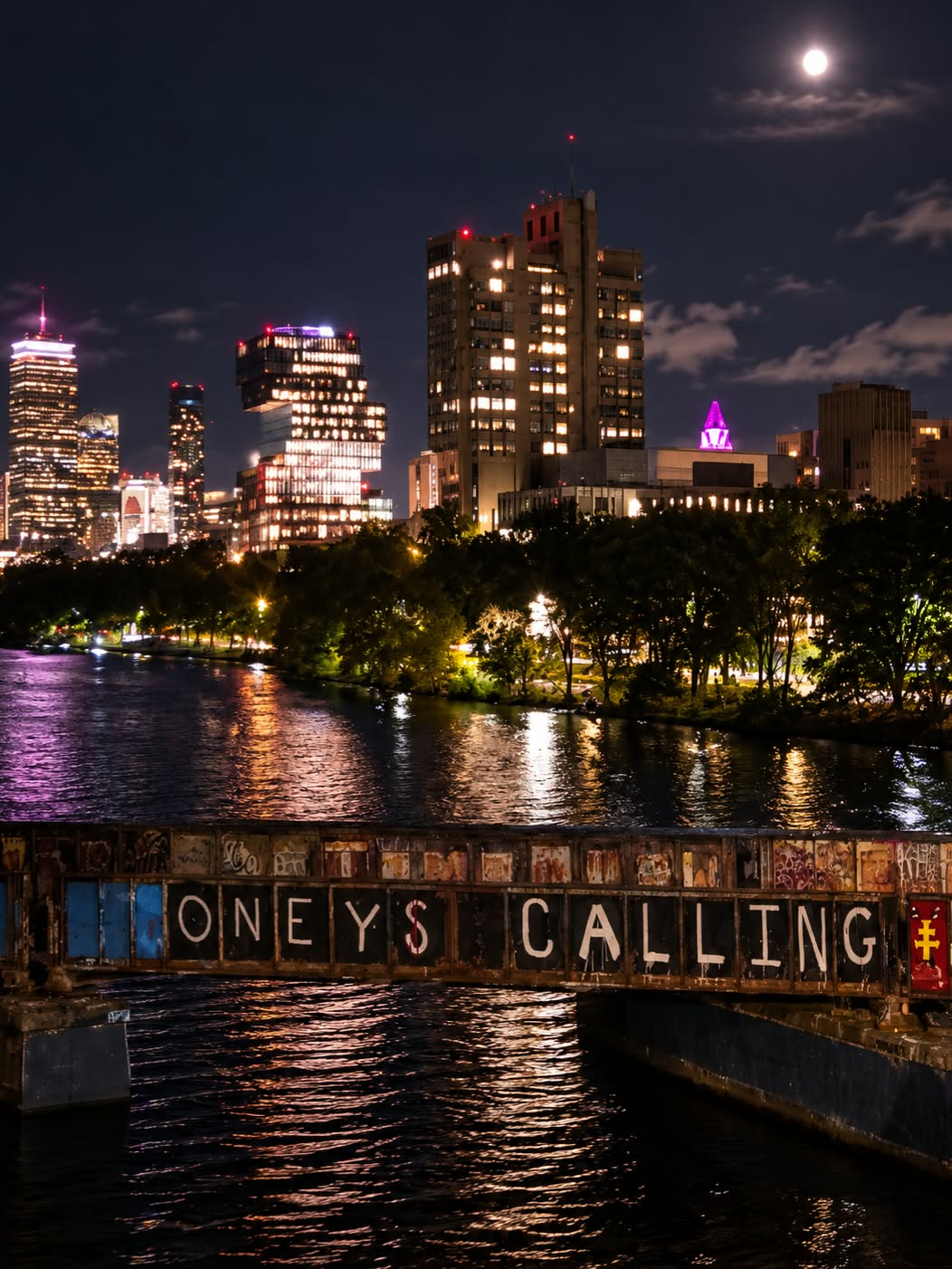 Boston skyline and river at night